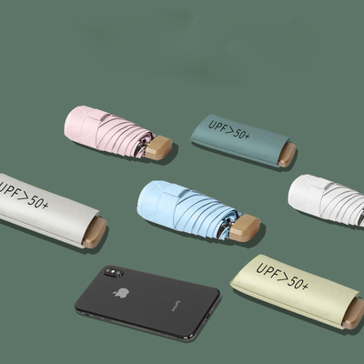 Viaje con estilo con Super Mini Pocket Anti UV Paraguas de oro de metal de fibra de vidrio costillas