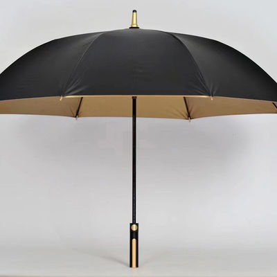Paraguas de tela recubierta de oro con control semiautomático y mango dorado
