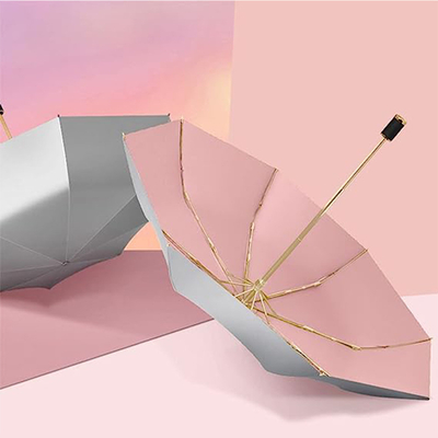 Paraguas de protección solar de tela de nylon 190T con diseño triple plegado y soporte de oro de macarrón